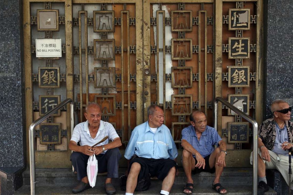 Seniors relax in a doorway in Sham Shui Po. The means-tested old-age pension for retirees in Hong Kong is a fraction of what seniors can hope to get in countries like Australia. Photo: Sam Tsang
