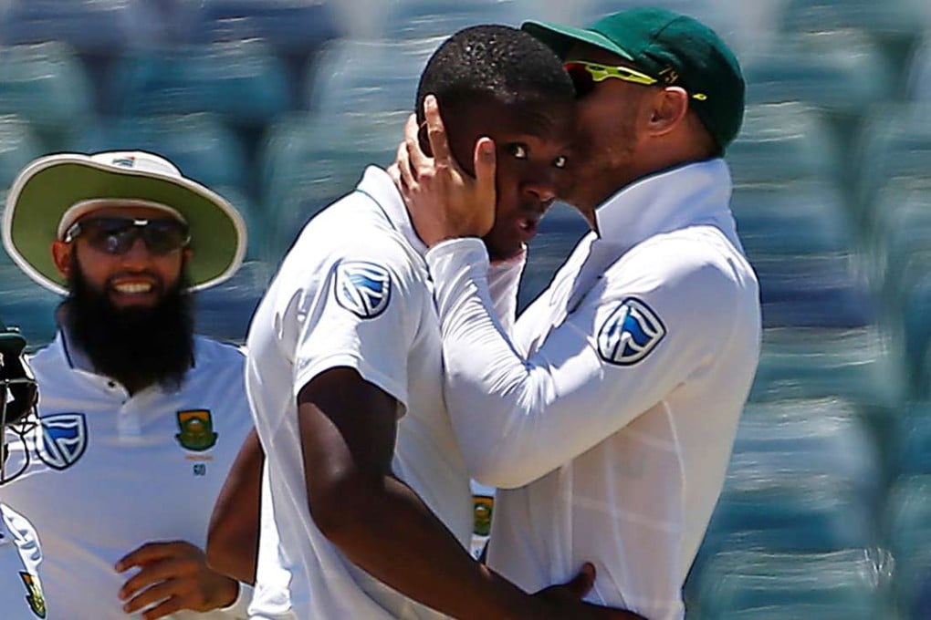 Star South Africa paceman Kagiso Rabada is kissed by captain Faf du Plessis as they celebrate dismissing Australia's Mitchell Starc at the WACA in Perth. Photo: Reuters