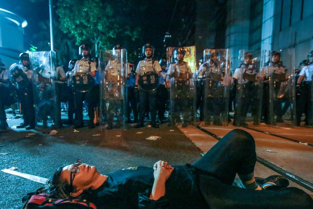 Protesters occupying Des Voeux street near the Chinese Liaison Office in Hong Kong during a protest against an expected interpretation of the city's constitution -- the Basic Law. Photo: Edward Wong