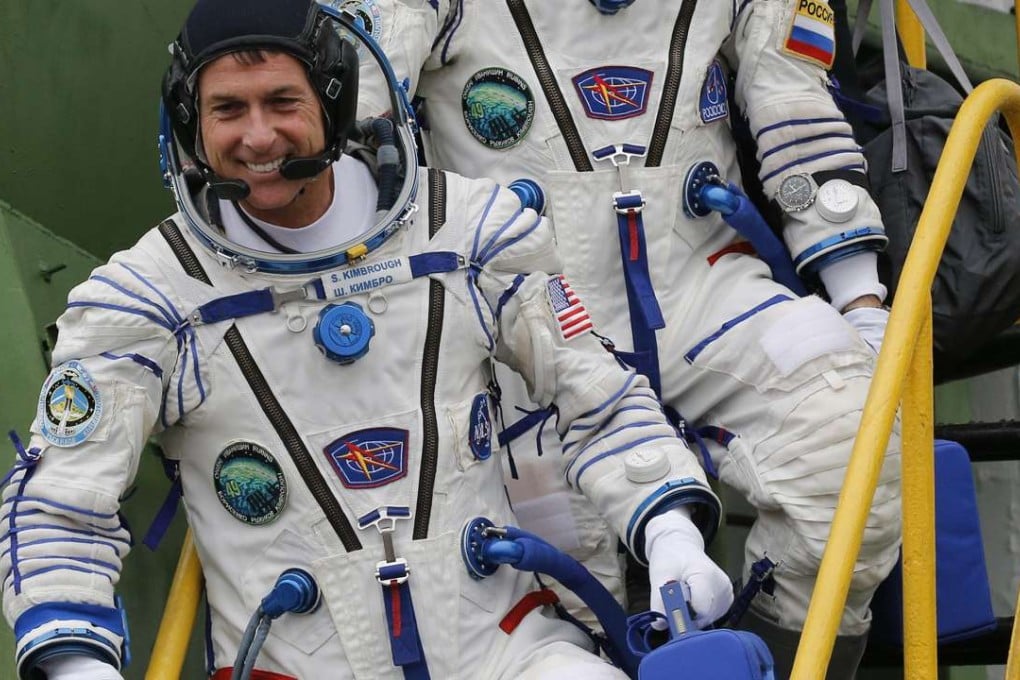US astronaut Shane Kimbrough boards the Soyuz MS-02 spacecraft at the Russian-leased Baikonur cosmodrome. Kimbrough became the latest astronaut to join in a long tradition of voting while floating above the Earth. Photo: AFP