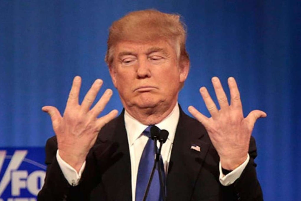 ‘I guarantee you, there’s no problem’: Donald Trump shows off the size of his hands in a televised debate after comments they were small. File photo: Reuters