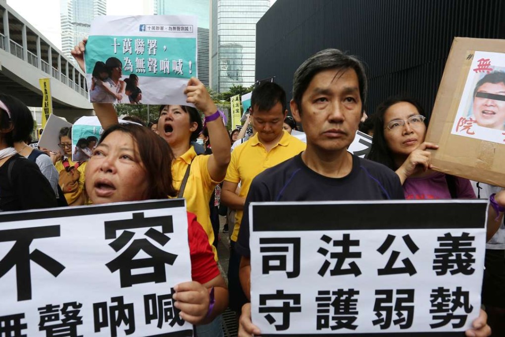 Concern groups march in protest at a decision to drop charges against the former head of the Bridge of Rehabilitation care home in Kwai Chung. Photo: Jonathan Wong