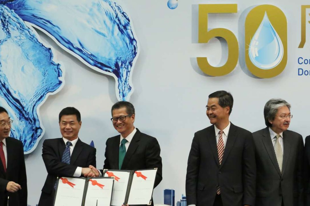 Marking 50 years of water supply from the Dongjiang to Hong Kong and the signing of the 2015-2017 agreement are (from left) Chen Lei, water resources minister, Lin Xudian, director-general of Guangdong’s Department of Water Resources, Hong Kong development chief Paul Chan, Chief Executive Leung Chun-ying, Financial Secretary John Tsang and Raymond Tam, secretary for Constitutional and Mainland Affairs, on May 28 last year. Photo: Felix Wong