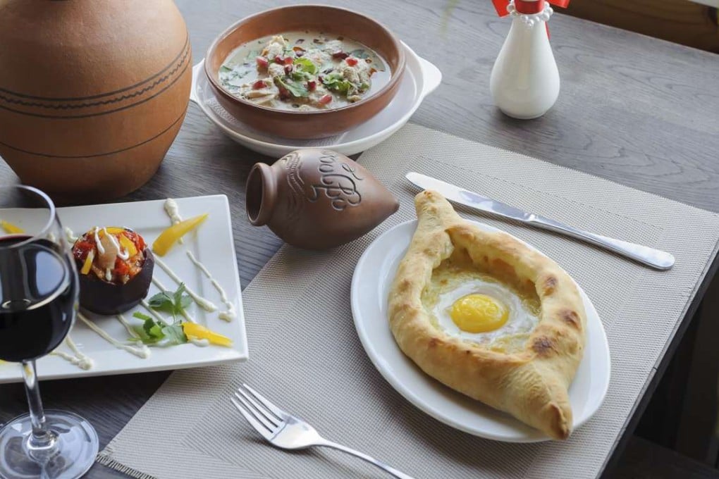 Georgian khachapuri bread served with wine.