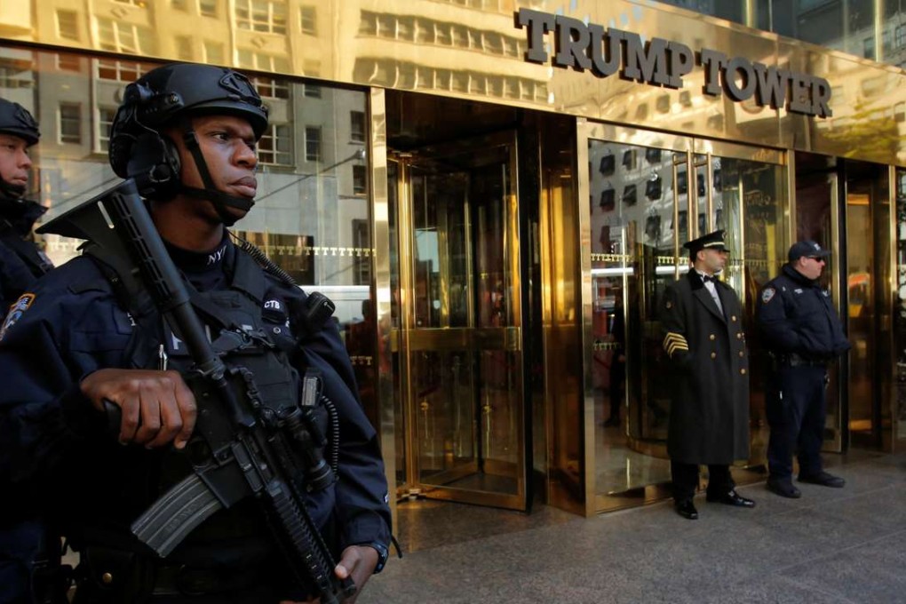 Members of the New York Police Department's Counterterrorism Bureau stand watch outside Trump Tower in Manhattan. Photo: Reuters