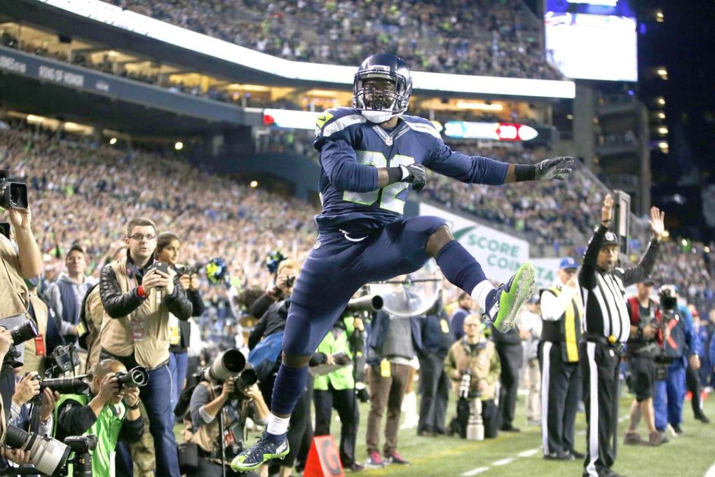 Seattle Seahawks Running back Christine Michael celebrates after scoring a touchdown against the Buffalo Bills at CenturyLink Field during Seattle’s 31-25 win. Photo: AFP