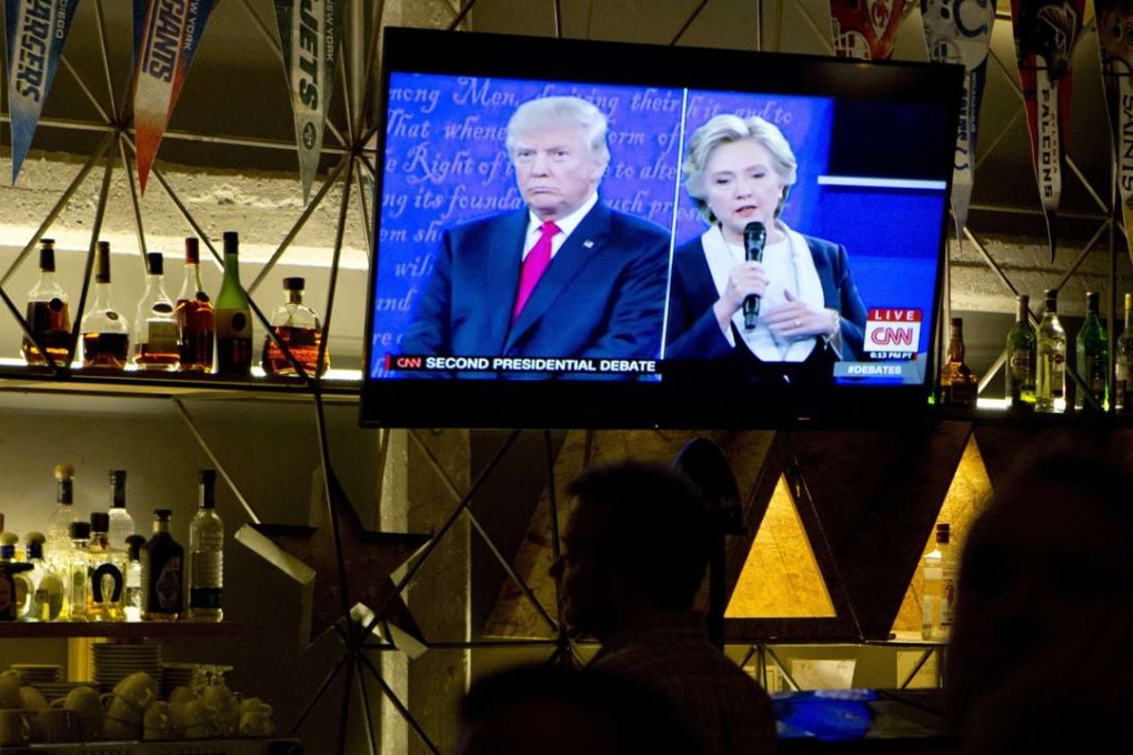 The second US presidential debate is shown on a TV screen at a restaurant. Photo: AP