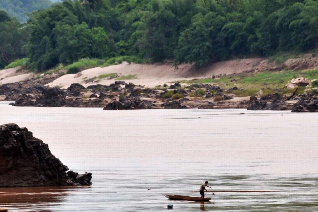 A fisherman in the Mekong River. Photo: EPA