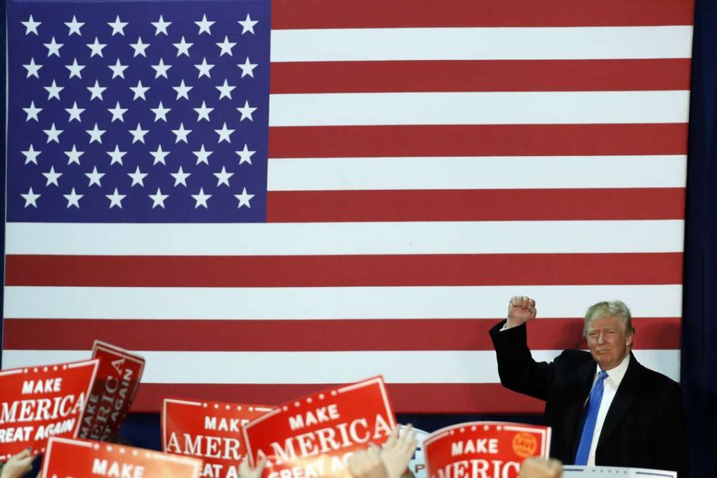 Republican presidential nominee Donald Trump pumps his fist after speaking at a rally in Leesburg, Virginia, on Monday. Photo: AP
