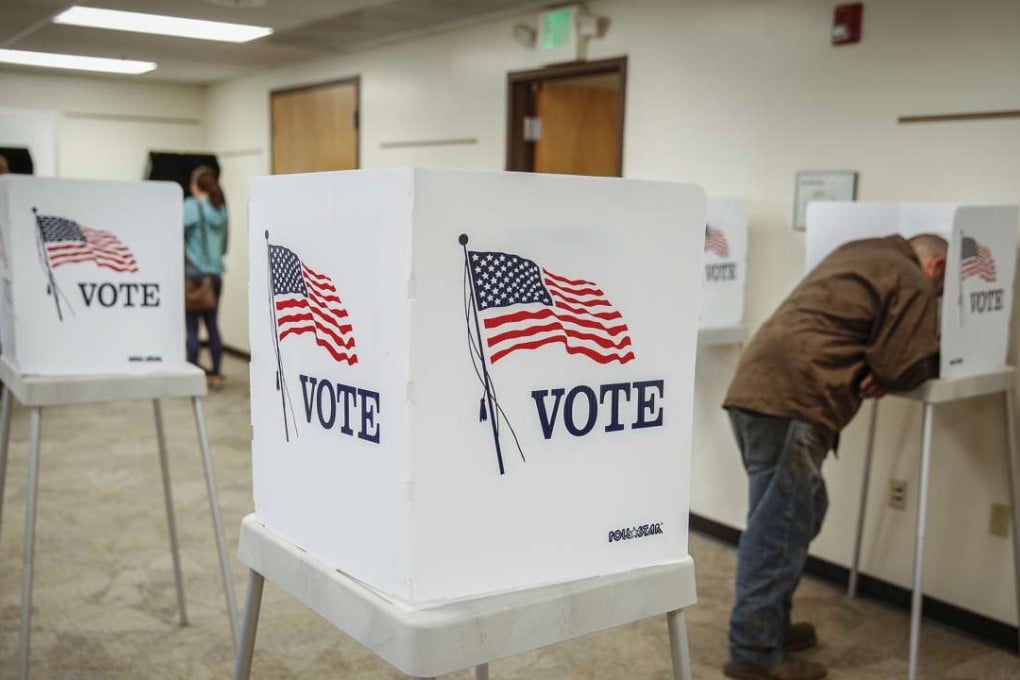 Murray Drohman, 35, of Golden, Colorado fills out his ballot at the Jefferson County Fairgrounds. The failure to call the US election is the latest in a string of high-profile mistakes by the polling industry. Photo: AFP