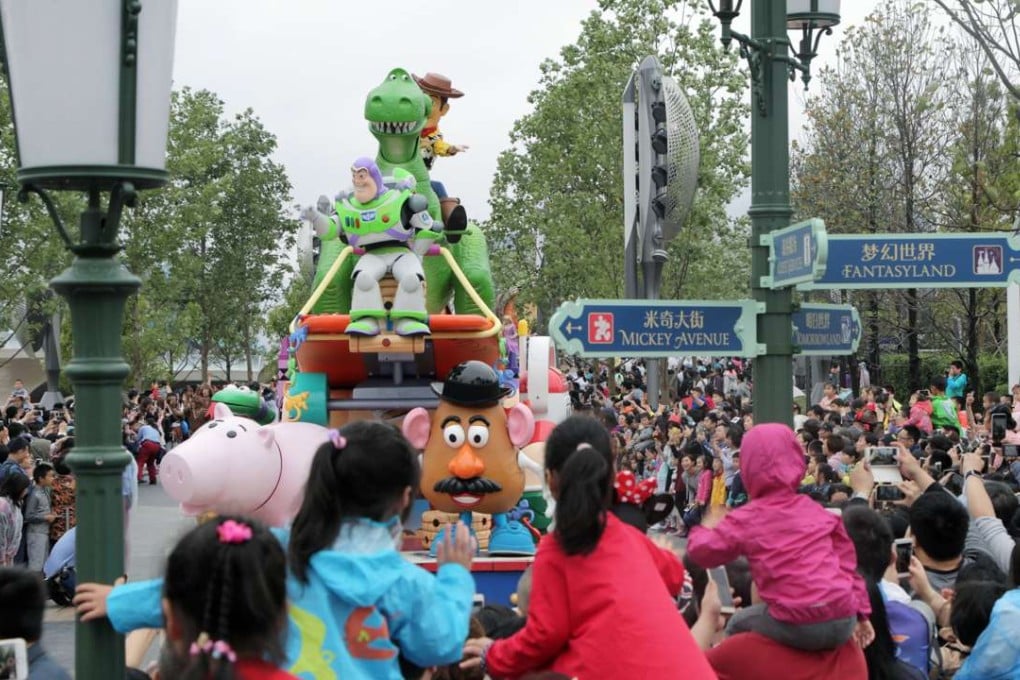 Tourists gather to watch a parade featuring Toy Story characters at Shanghai Disneyland. Photo: SCMP Pictures