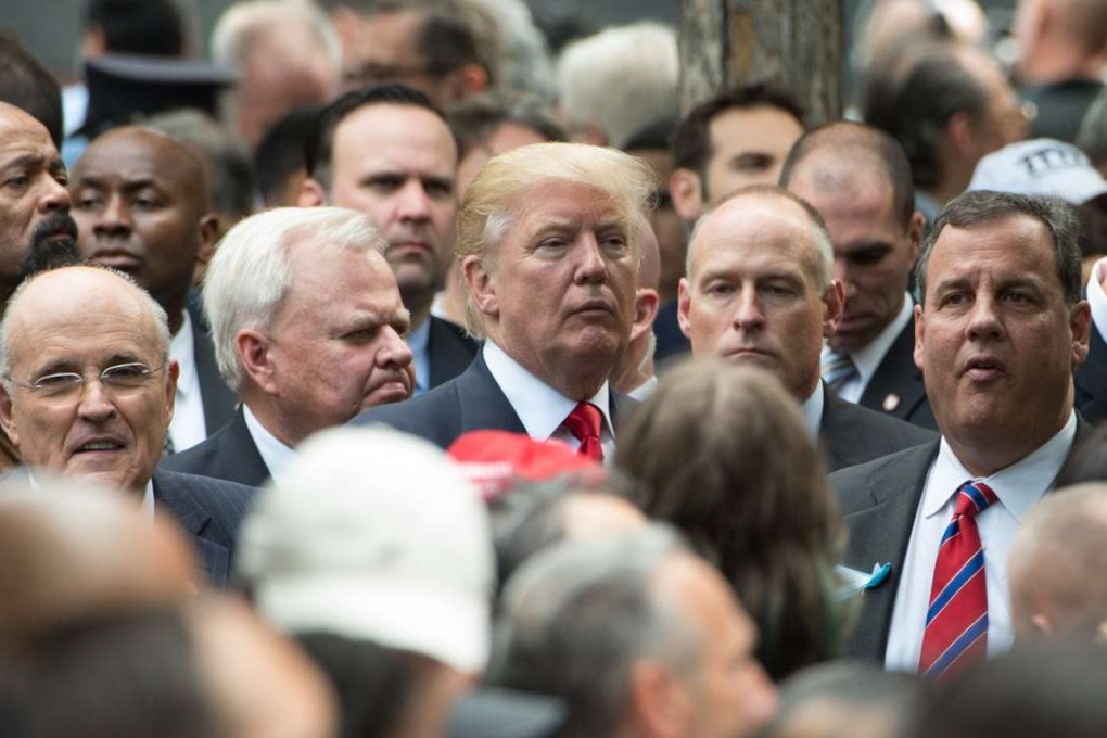 This file photo taken on September 11, 2016 shows former New York City Mayor Rudy Giuliani (left), Republican President-elect Donald Trump (centre) and New Jersey Governor Chris Christie (right)as they stand together during a memorial service in New York. Photo: AFP