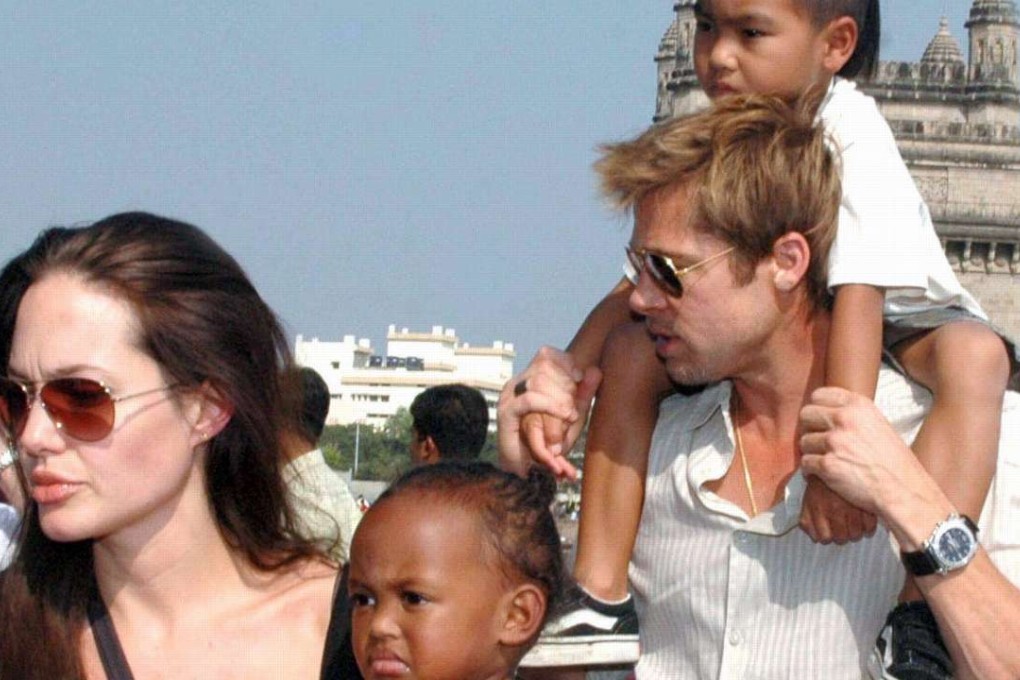 A file picture dated 12 November 2006 shows US actress Angelina Jolie with daughter Zahara and US actor Brad Pitt with son Maddox walking near the Gateway of India in Mumbai. Photo: EPA