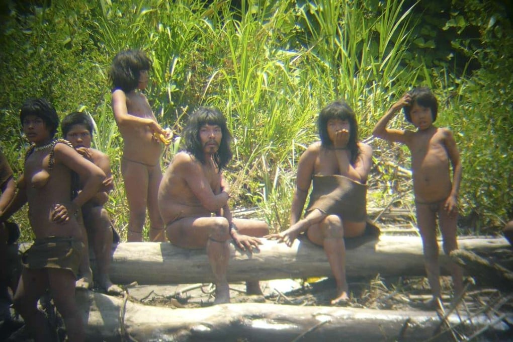 Members of the Mashco Piro tribe observe a group of travellers from across the Alto Madre de Dios river in the Manu National Park in the Amazon basin of southeastern Peru, as photographed through a bird scope in this file picture from 2011. Photo: Reuters