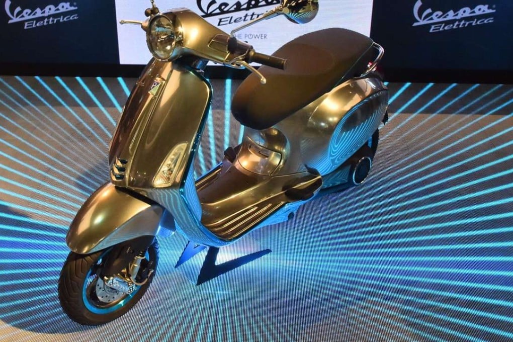 A Vespa Elettrica (electric Vespa scooter) is presented during the International fair for Cycles and Motocycles, on Thursday in Milan. Photo: AFP