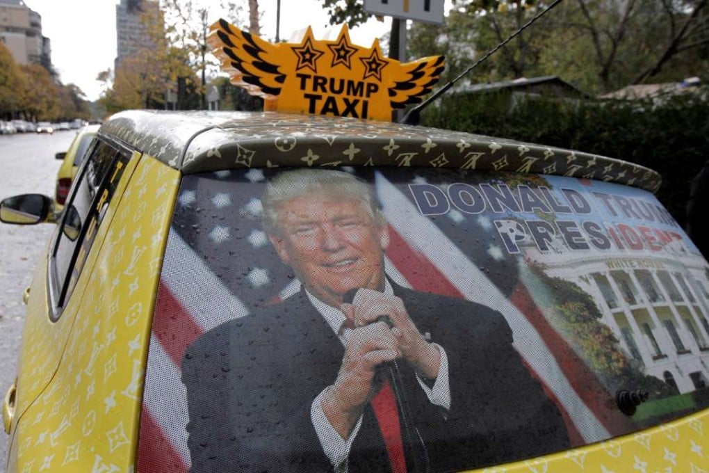 A taxi in Tirana, Albania, is decorated with a picture of Donald Trump to celebrate his victory in the US election. Those who have been accused of elitist arrogance need to at least try to see things from their accusers’ point of view. Photo: Reuters