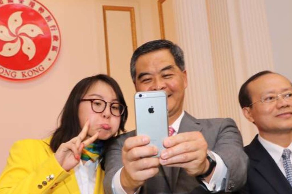 Chief Executive CY Leung takes a selfie with China Olympic swimmer Fu Yuanhui – he might have to start paying a bit more attention to sport if he runs again in 2017.