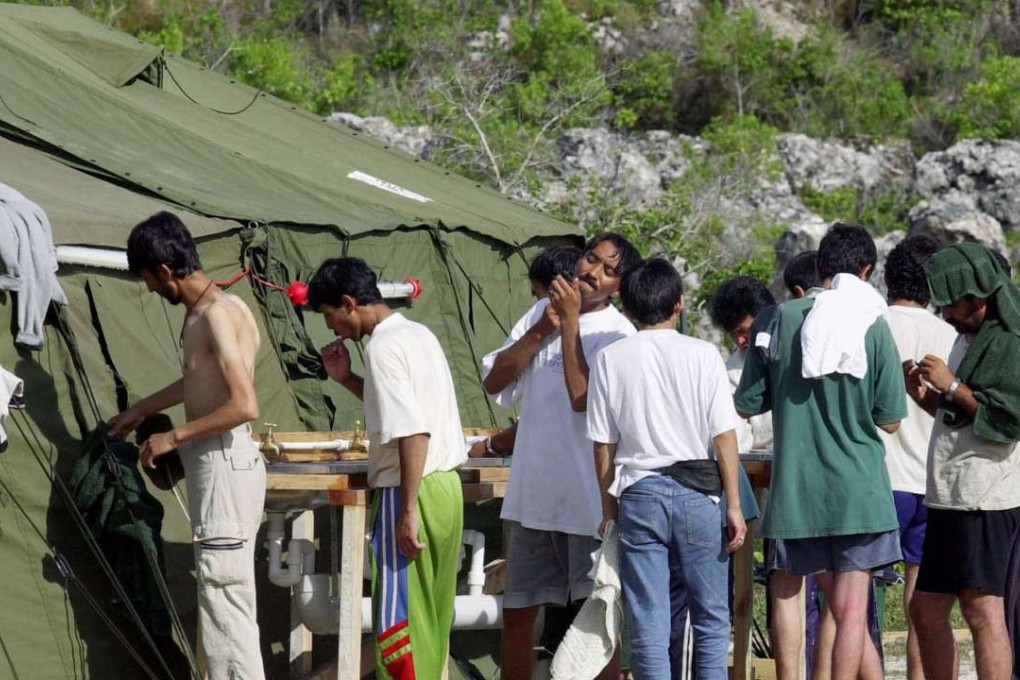 Men shave, brush their teeth and prepare for the day at a refugee camp on the Island of Nauru. Photo: AP