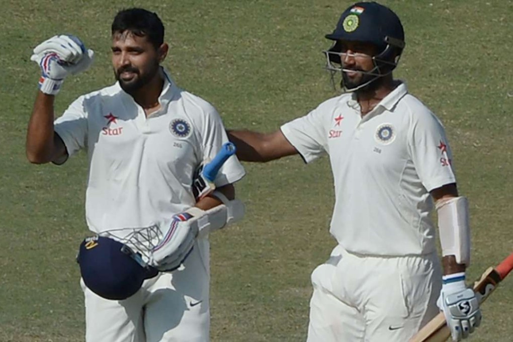 India's Murali Vijay (left), and teammate Cheteshwar Pujara each scored a century to dominate the third day of the first test against England. Photos: AFP