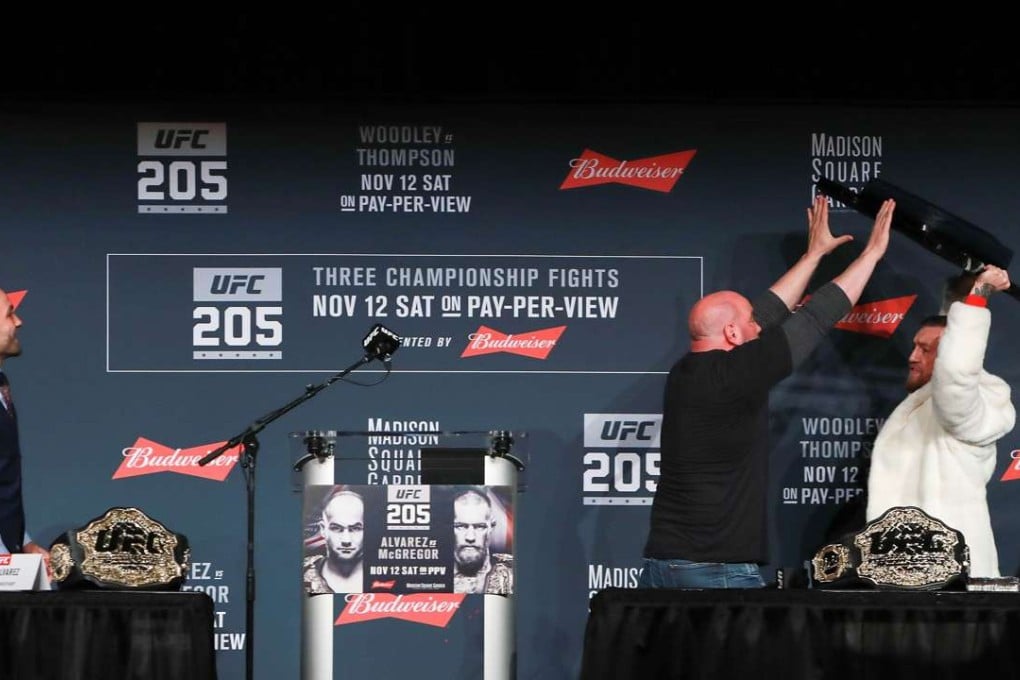 UFC president Dana White stops Conor McGregor from throwing a chair at Eddie Alvarez during the UFC 205 media conference at The Theatre at Madison Square Garden. Photo: AFP