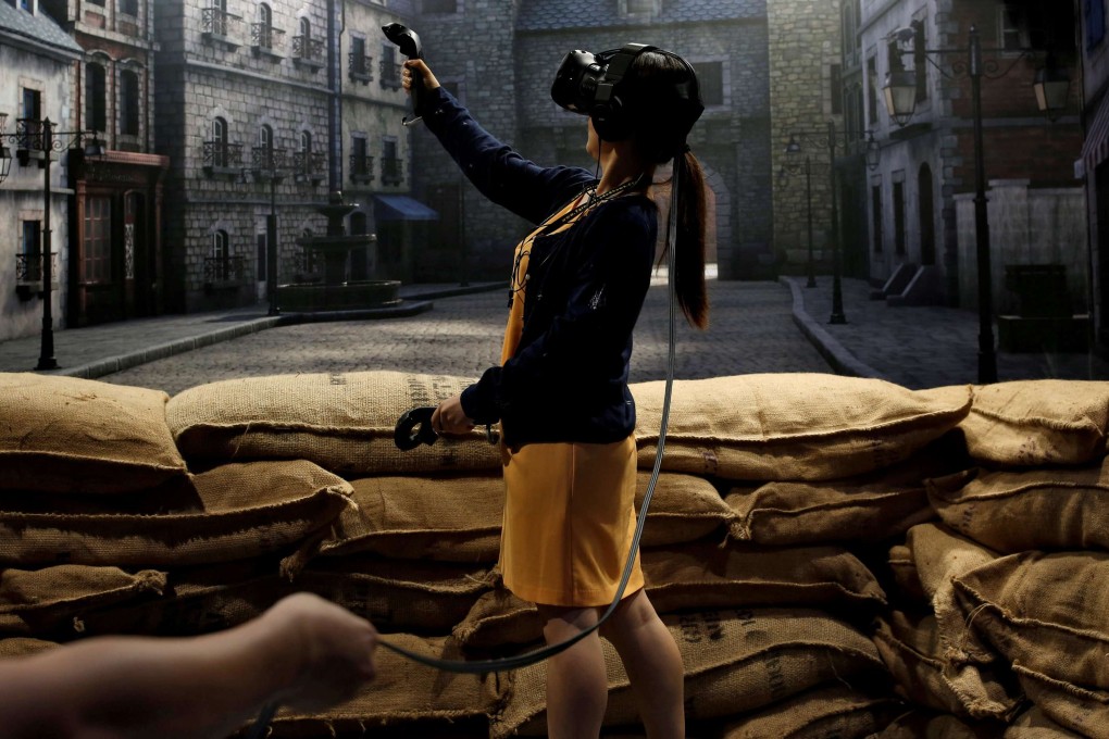 A visitor to Taipei’s annual Computex exhibition tries a pair of HTC's Vive Virtual Reality goggles. Photo: Reuters