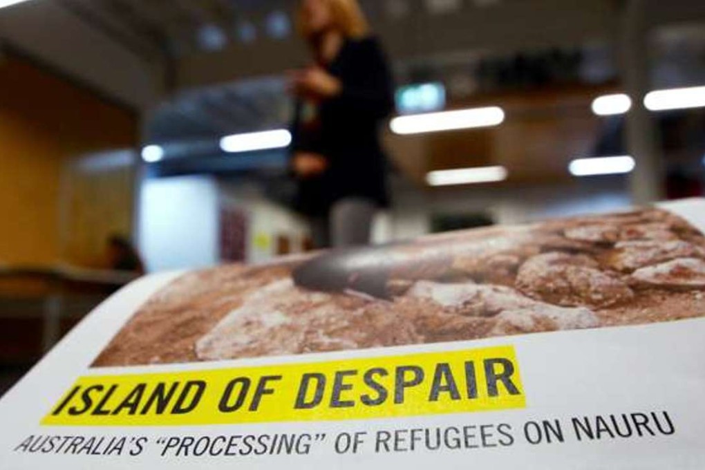 Anna Neistat, Senior Director for Research with Amnesty International, talks to journalists behind a copy of a report she co-authored titled 'Island of Despair - Australia's "Processing" of Refugees on Nauru' in Sydney, Australia, October 17, 2016 that concludes many of the 410 asylum seekers held on the tiny Pacific Island are being driven to attempt suicide to escape the prison-like conditions they face in indefinite detention on behalf of Australia. Photo: Reuters