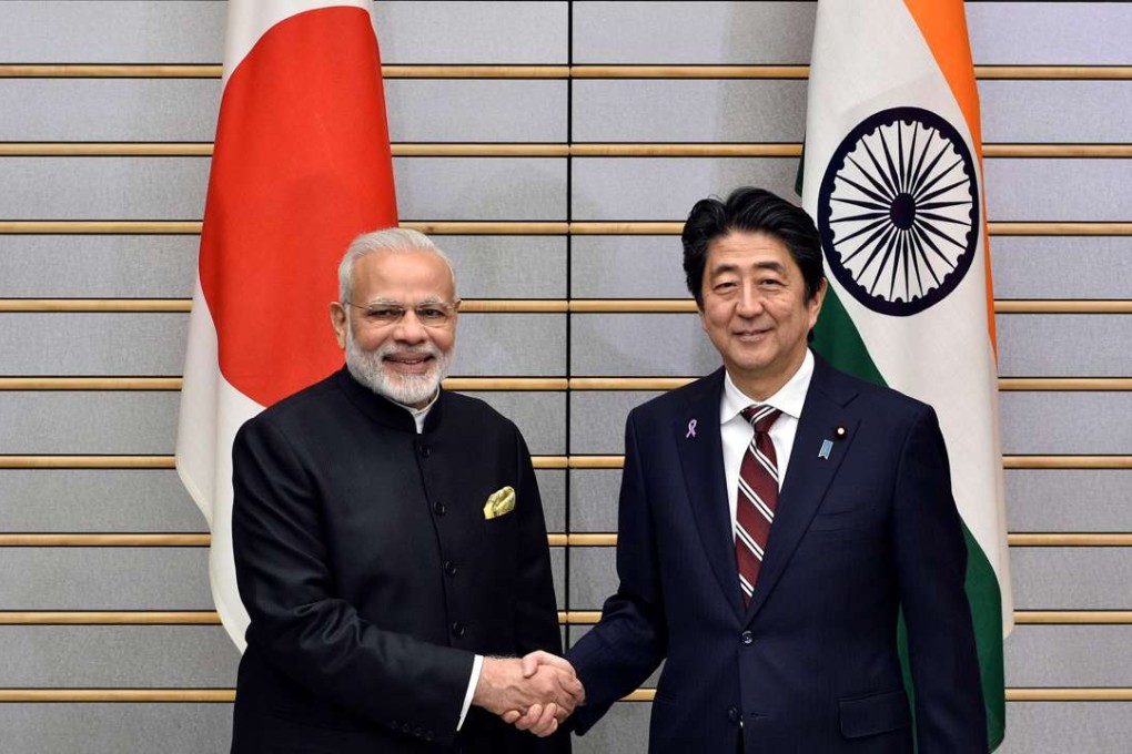 Indian Prime Minister Narendra Modi shakes hands with Japan's Prime Minister Shinzo Abe. Photo: Reuters