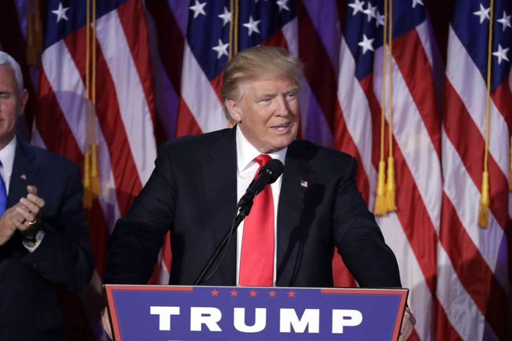 President-elect Donald Trump gives his acceptance speech during his election night rally on Wednesday, to applause from Vice-President-elect Mike Pence. Photo: AP