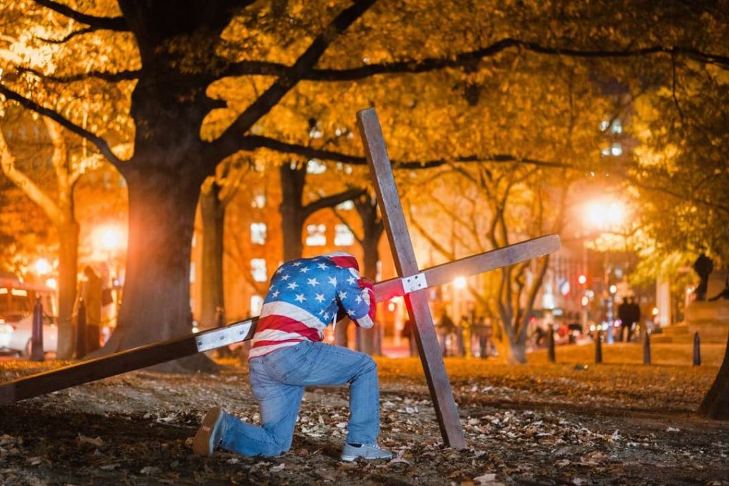 Christians pray in front of the White House on the night of the US election. The group said they were not biased towards either candidate. Photo: AFP