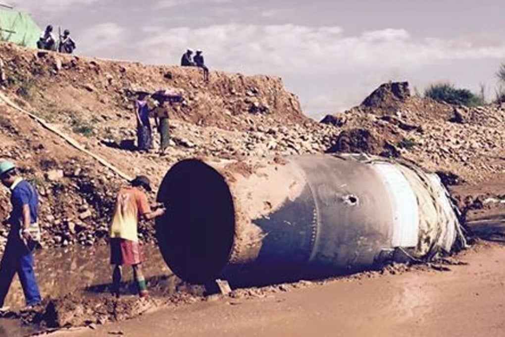 A large metal cylinder thought to be from a Chinese satellite or aircraft fell from the sky. Photo: SCMP Pictures