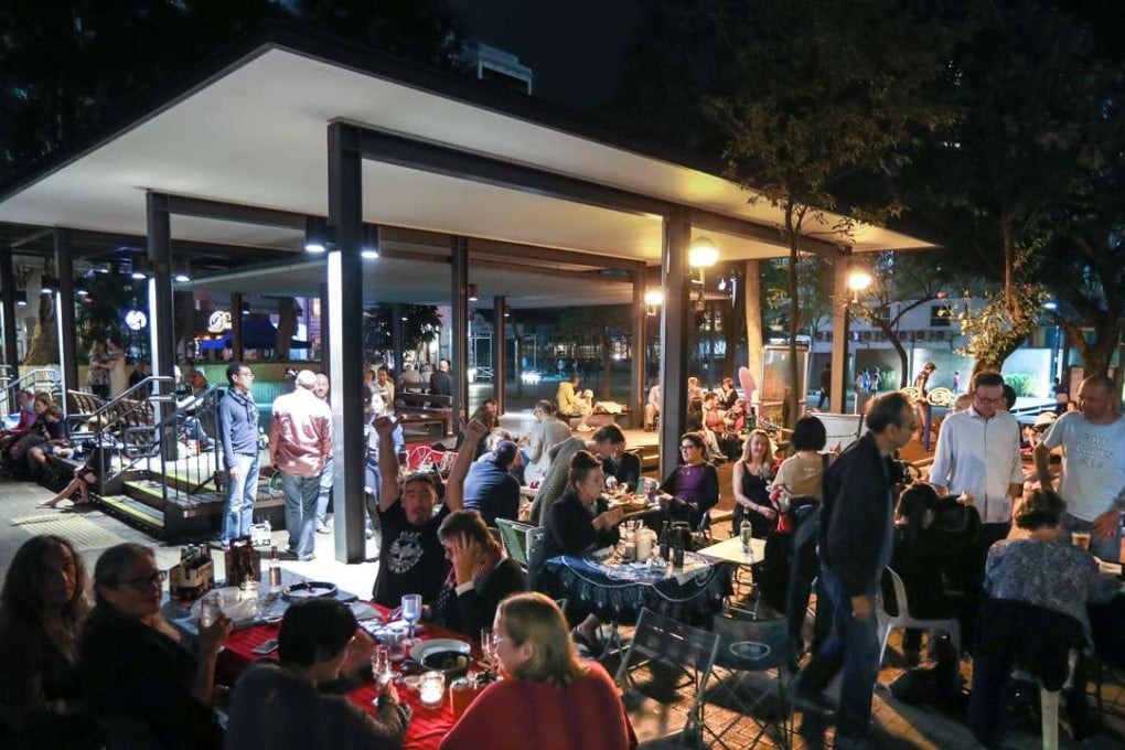Hong Kong residents gather in a public open space in Sai Kung with tables, chairs and takeout food for FEHD Appreciation Night - a protest agains the government’s alfresco dining regulations. Photo: Nora Tam