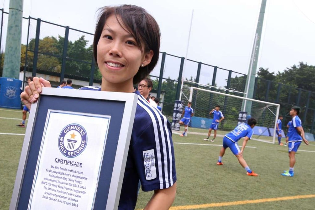 Eastern coach Chan Yuen-ting receives Guinness World Record certificate for the first female football coach to win a top-flight men's championship. SCMP/David Wong