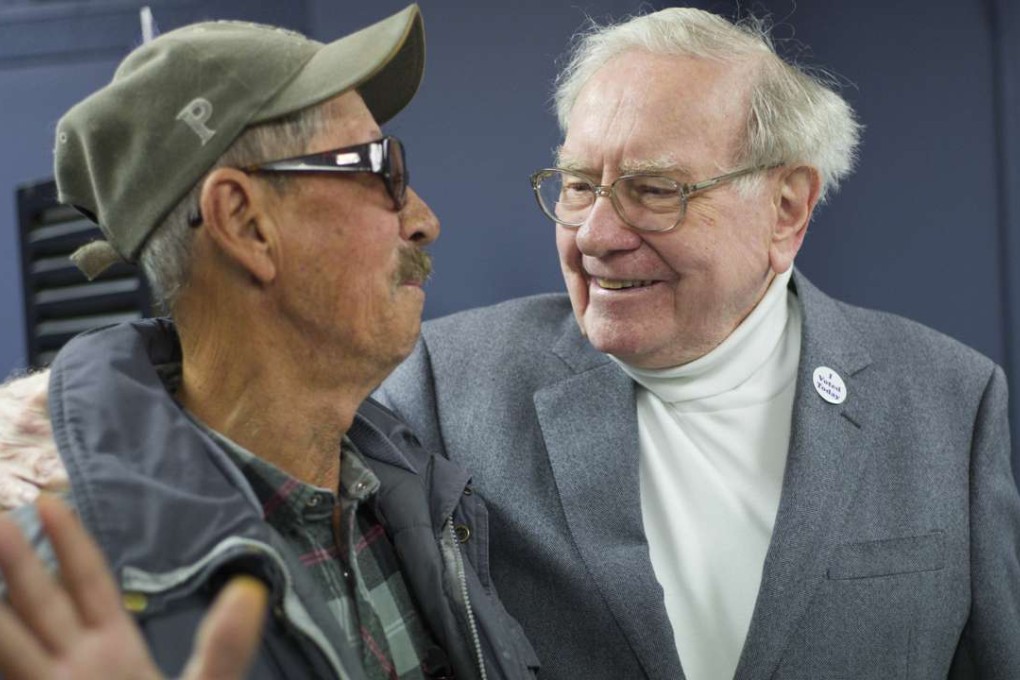 Billionaire investor Warren Buffett, right, greets first-time-voter Pedro Cruz before taking him to his polling station, on election day in Omaha, Nebraska. Photo: AP
