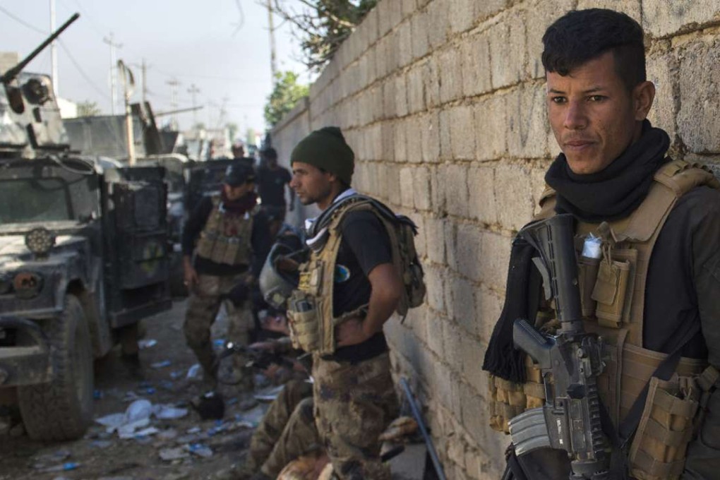 Soldiers from the Iraqi Special Forces in the Arbagiah neighbourhood of Mosul. Photo: AFP