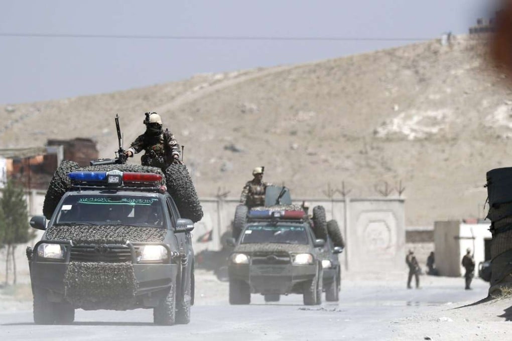 Afghan security officials securing the scene of a truck bomb blast in August. Photo: EPA