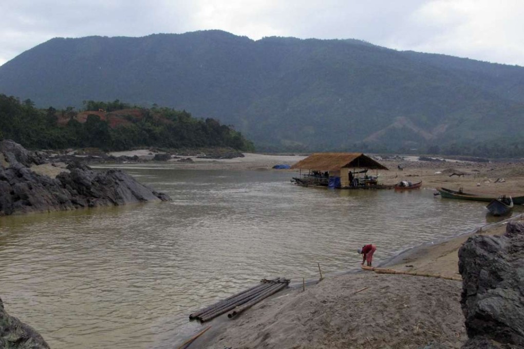A woman works on the bank of the Irrawaddy river in Kachin State, northern Myanmar in 2011. Photo: AP