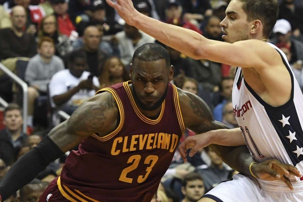 LeBron James, left, tries to make his way past Wizards guard Tomas Satoransky during the second half of their game at the Verizon Center in Washington, D.C. Washington Post photo by Toni L. Sandys