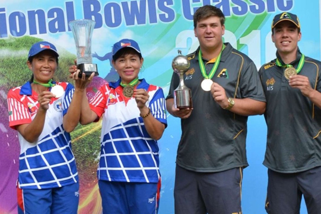 Philippines' Rosita Bradborn and Sonia Bruce celebrate with Australia’s Corey Wedlock and Nathan Pedersen after winning the women and men's pairs titles at the Hong Kong International Bowls Classic on Sunday. Photos: SCMP Pictures
