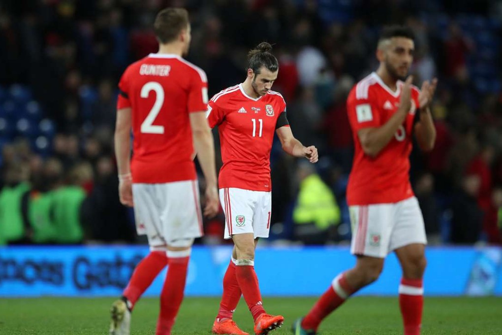 Wales’ Gareth Bale (centre) leaves the pitch after the final whistle of the 2018 World Cup group D qualifier. Photo: AP