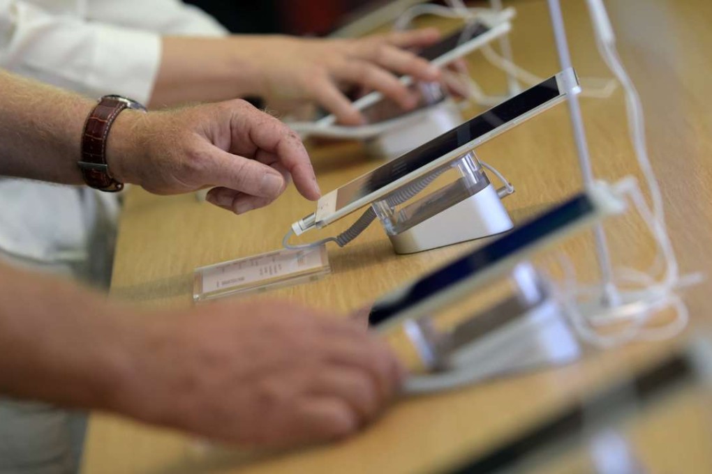 Visitors try out Huawei tablets at the IFA Electronics show in Berlin, Germany, in September. The Chinese company aims to become the world’s second-largest maker of smartphones within two years. Photo: Reuters