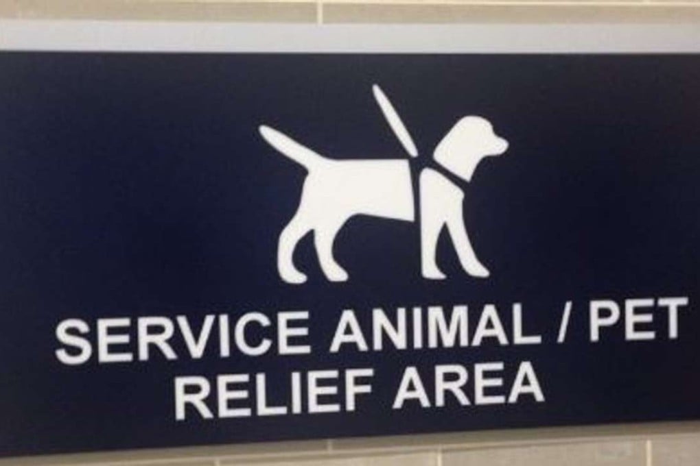 A pet relief area sign in a US airport.