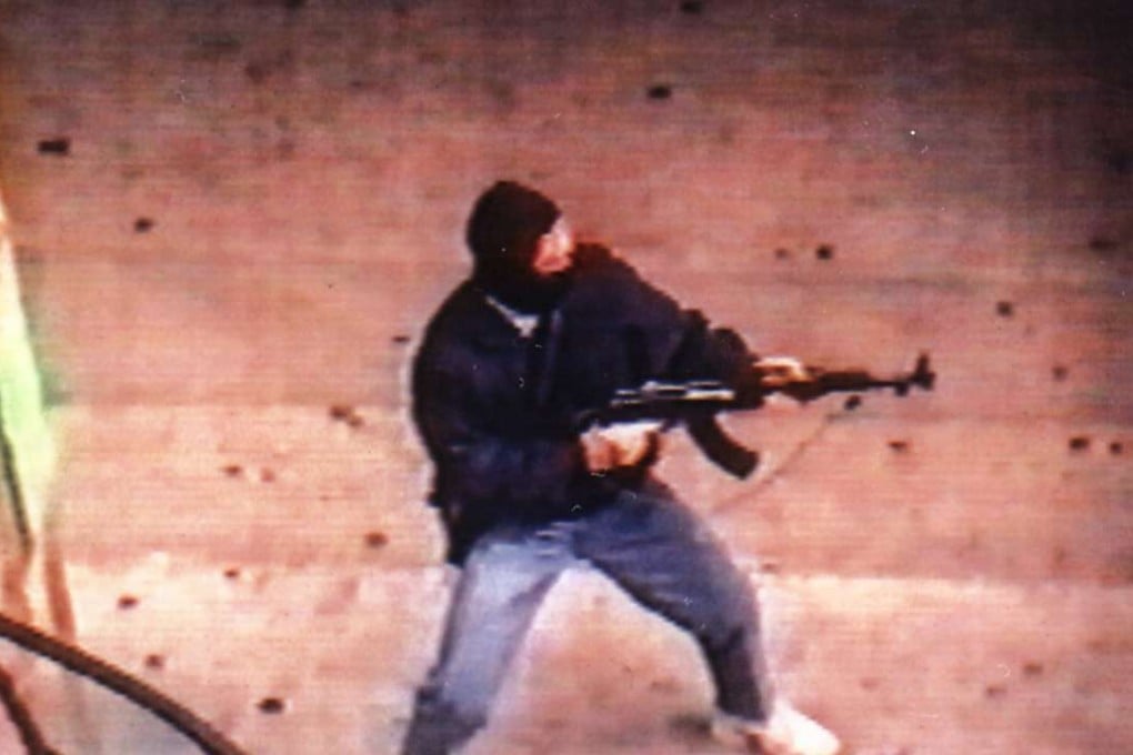 Armed robber Yip Kai-foon using an AK-47 in Hong Kong.