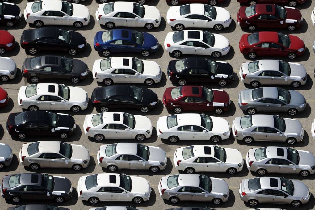 File photo from 2006 shows General Motors Pontiac G-6 cars lined up for delivery at the Orion assembly plant in Michigan - a rust belt state narrowly won by Donald Trump in the election. Many of the forgotten white underclass had already gravitated to the Republican Party before the election. Photo: AFP