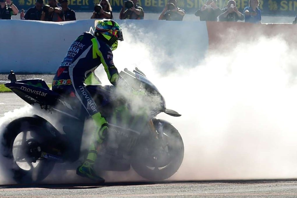 Italian rider Valentino Rossi could be in trouble after appearing to deliberately ride into a woman on a scooter. Photo: AFP