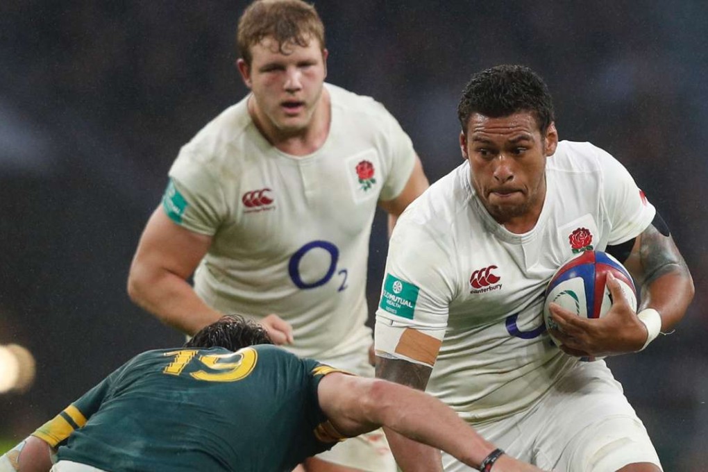 England's Nathan Hughes is tackled by South Africa's Franco Mostert. Photo: AFP