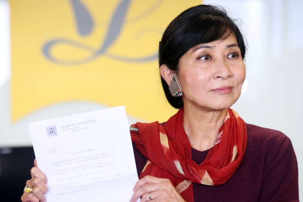 Lawmaker Claudia Mo Man-ching announcing her resignation from the Civic Party at Tamar on Monday. Photo: David Wong