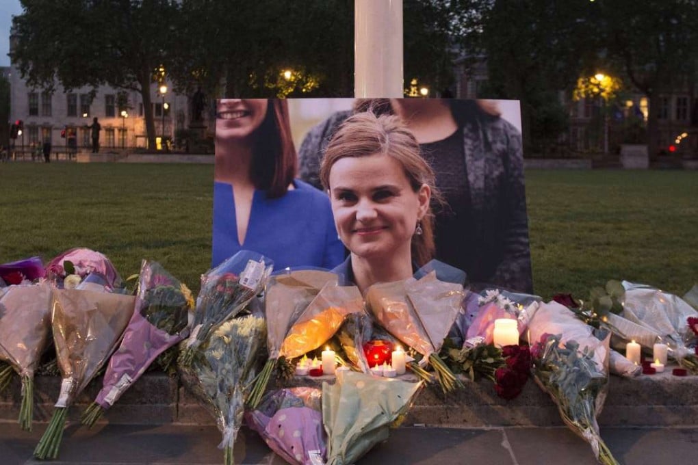 Floral tributes are left in memory of late British MP Jo Cox at Parliament Square in London on June 16. Photo: EPA