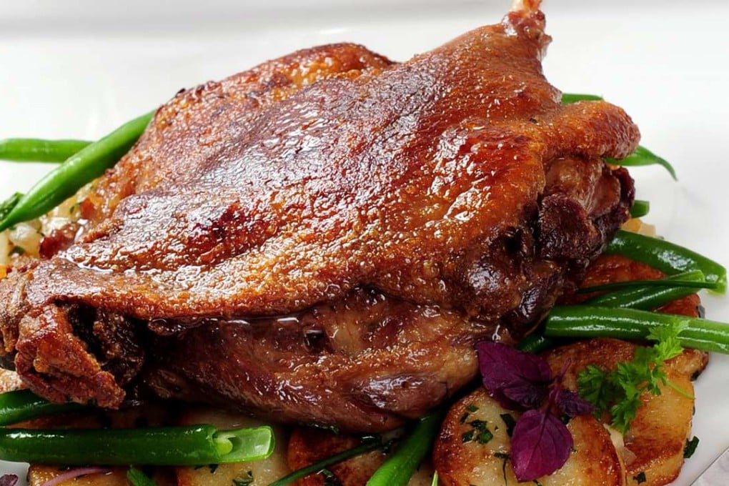 Duck leg confit served on Lyonnaise potatoes at Fauchon.