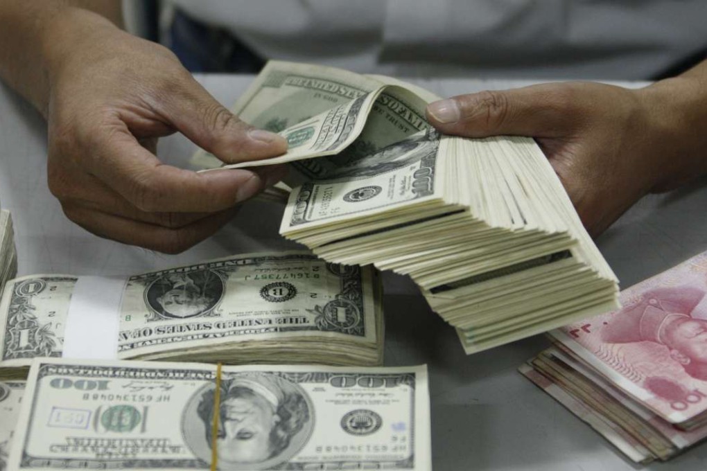 The exchange rate for yuan against the US dollar traded within China broke the key level of 6.8 last week. Photo: Reuters