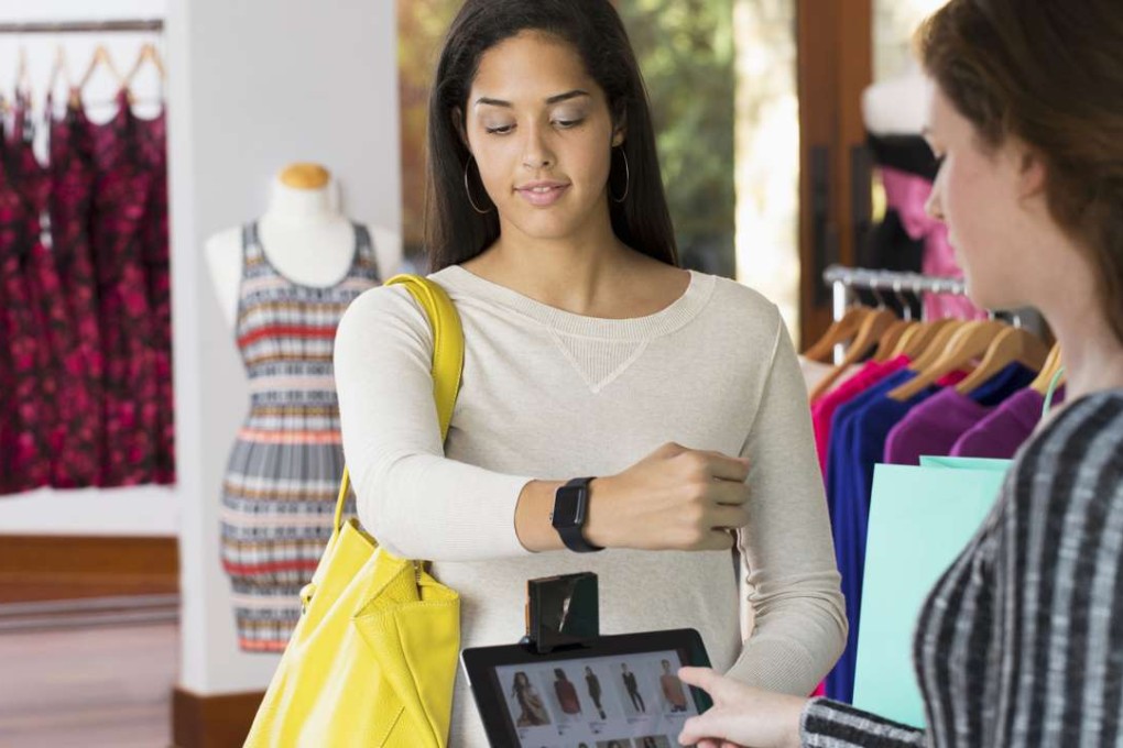 A customer pays using a smart watch. Photo: Alamy Stock Photo